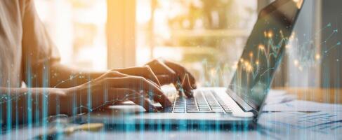 The dynamic laptop with hands typing and financial data visualization. photo