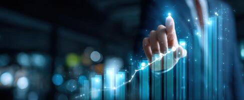The hand directing a rising graph in a digital business environment. photo
