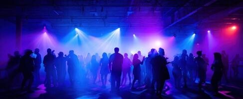 The vibrant atmosphere of a lively dance party with dynamic lighting and silhouettes. photo