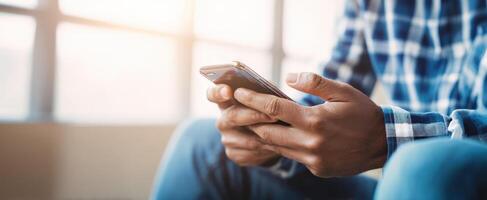 The smartphone in hands of a user engaging with technology indoors. photo