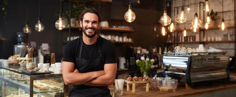 A smiling man standing in front of a coffee shop photo