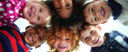 The group of cheerful children with vibrant smiles celebrating their friendship. photo