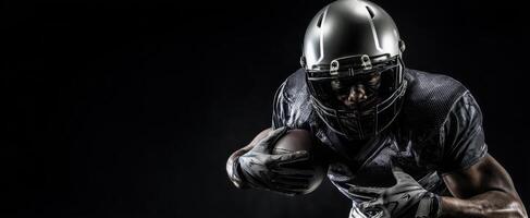 The football player in action during a dramatic night sporting event photo