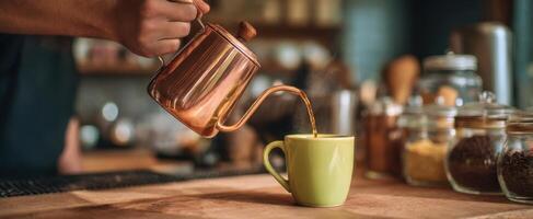 A person pours coffee into a cup photo