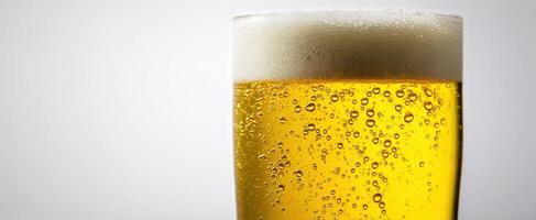 The refreshing glass of beer with frothy foam and sparkling bubbles. photo