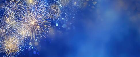 The vibrant fireworks display lighting up the night sky in blue hues. photo