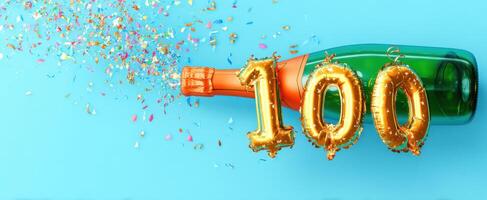 The sparkling champagne bottle celebrating a joyous 100 milestone with confetti. photo