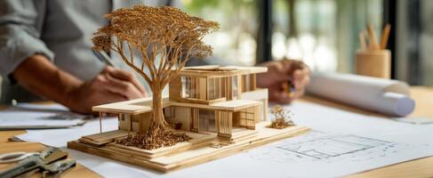 The architectural model showcasing a unique design with an integrated tree element. photo