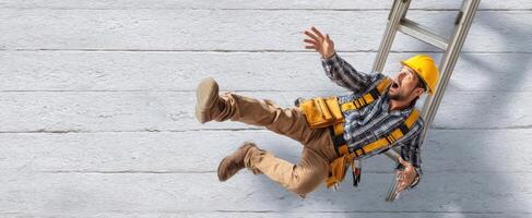 The construction worker falling from a ladder in a dramatic safety incident. photo