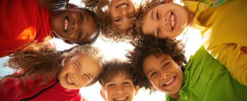 The joyful group of children smiling together in a vibrant outdoor setting photo