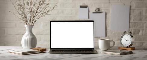 The stylish workspace featuring a laptop and modern accessories. photo