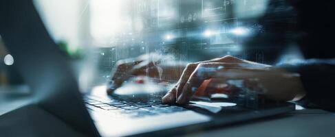 The Hands Typing on a Laptop with a Futuristic Digital Overlay photo