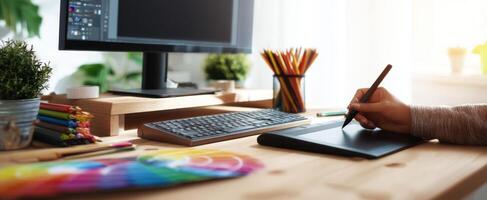 The modern workspace featuring a drawing tablet and computer setup. photo