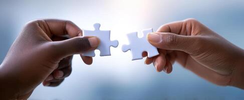 The Hands Connecting Puzzle Pieces to Symbolize Partnership and Unity photo
