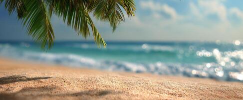The serene beach scene with palm leaves framing the sparkling ocean. photo