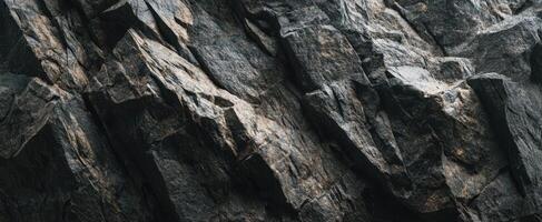 The rugged surface of layered rocks showcasing complex geological formations. photo