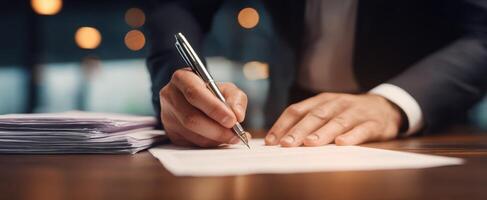 The Man Signing Important Document at Modern Office Desk photo