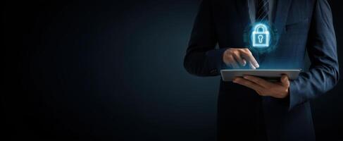 The businessman using a tablet with a digital lock symbol for security. photo