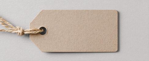 The blank brown tag with rope for crafting and labeling purposes photo