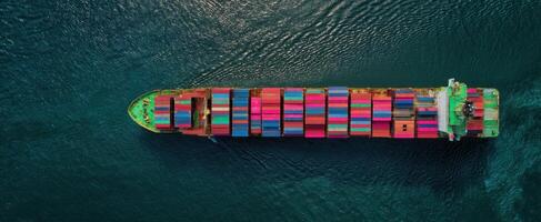 The colorful cargo ship navigating through crystal-clear ocean waters. photo