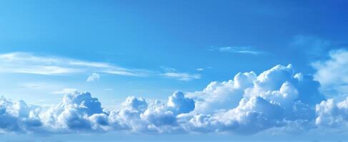 The serene beauty of fluffy white clouds against a bright blue sky. photo