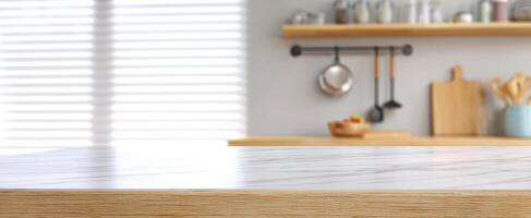 The modern kitchen countertop with elegant marble and wooden accents. photo