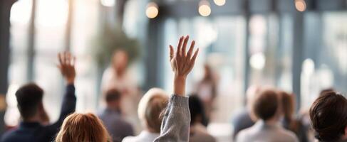 The audience actively engaged in a dynamic presentation with raised hands. photo