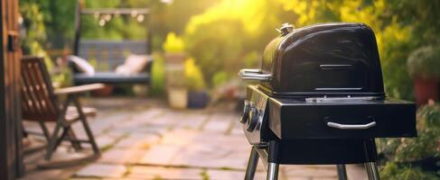 The modern charcoal grill ready for summer evening barbecues in a lush garden. photo