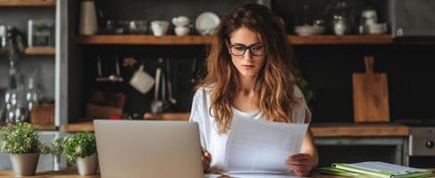 The focused woman reading documents at her stylish home office workspace. photo