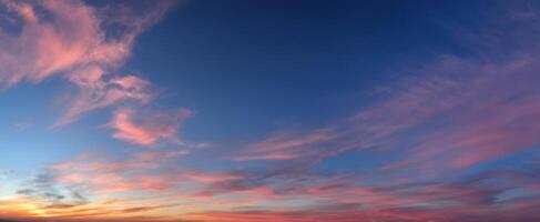 The breathtaking sunset sky with vibrant colors and soft clouds. photo