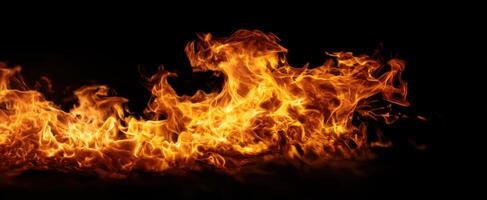 The Vibrant Flames Dancing Against a Dark Background photo