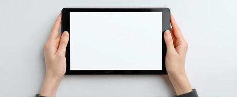 The tablet displayed in hands ready for digital content creation. photo