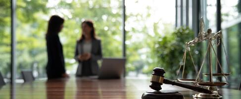 The gavel symbolizes justice in a modern law office setting. photo