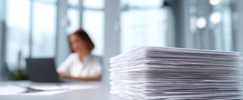 The Stack of Papers on a Desk in a Modern Office Environment photo