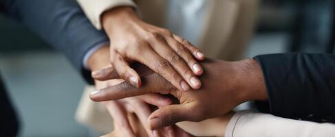 The hands of teamwork symbolize unity and collaboration in a professional setting. photo