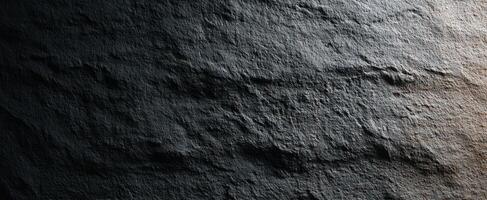 The Dark Textured Surface of a Naturally Weathered Stone. photo