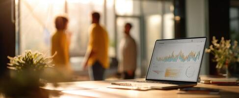 The laptop displaying data analytics in a modern office environment. photo