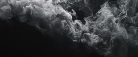 The mesmerizing swirl of smoke against a dark background, creating a mystic atmosphere. photo