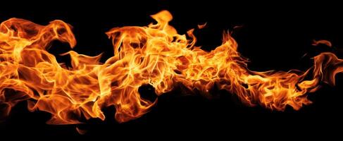 The vibrant flames dancing in darkness create a mesmerizing, fiery spectacle. photo