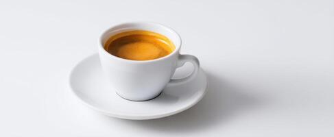 The elegant white cup of espresso against a minimalist backdrop photo