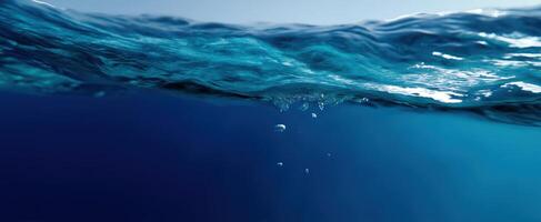 The tranquil underwater view showcasing the beauty of ocean waves and bubbles. photo
