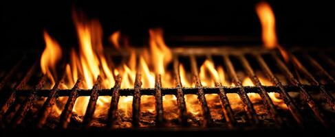 The vibrant flames dancing on a modern barbecue grill. photo