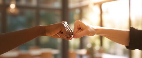 The hands connecting in a gesture of friendship and unity in a bright environment. photo