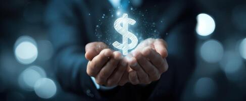 The glowing dollar sign held in hands symbolizing financial opportunity and wealth creation. photo