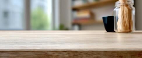 The wooden kitchen countertop with jar and utensils in a modern setting. photo