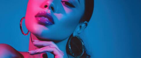 The striking portrait of a glamorous model with vibrant lighting and bold makeup. photo