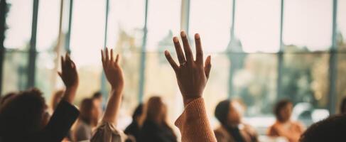 The enthusiastic attendees raise hands in a dynamic educational setting. photo