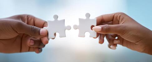 The Hands Connecting Two Puzzle Pieces in Symbolic Collaboration photo