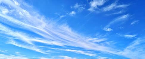 The Beautiful Sky with Soft Clouds Illuminating a Bright Day photo