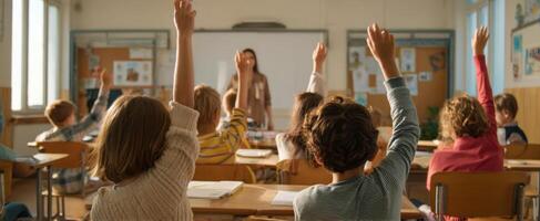 The engaged students raising hands in a lively classroom learning environment. photo